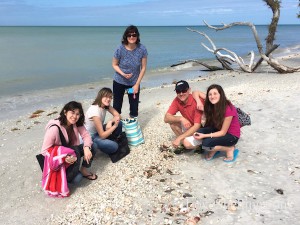 Family shelling on Cayo Costa Florida beach